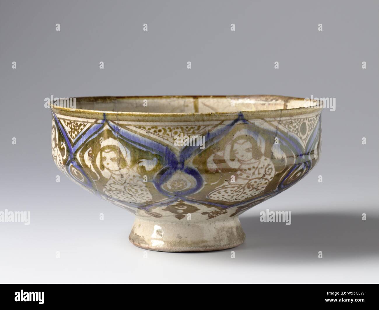 Bowl with a seated lady in a panel decoration, Bowl of quartz-frit ware  decorated with polychrome luster on an opaque white tin-lead alkaline  glaze. The outer wall is bored in scalloped compartments,