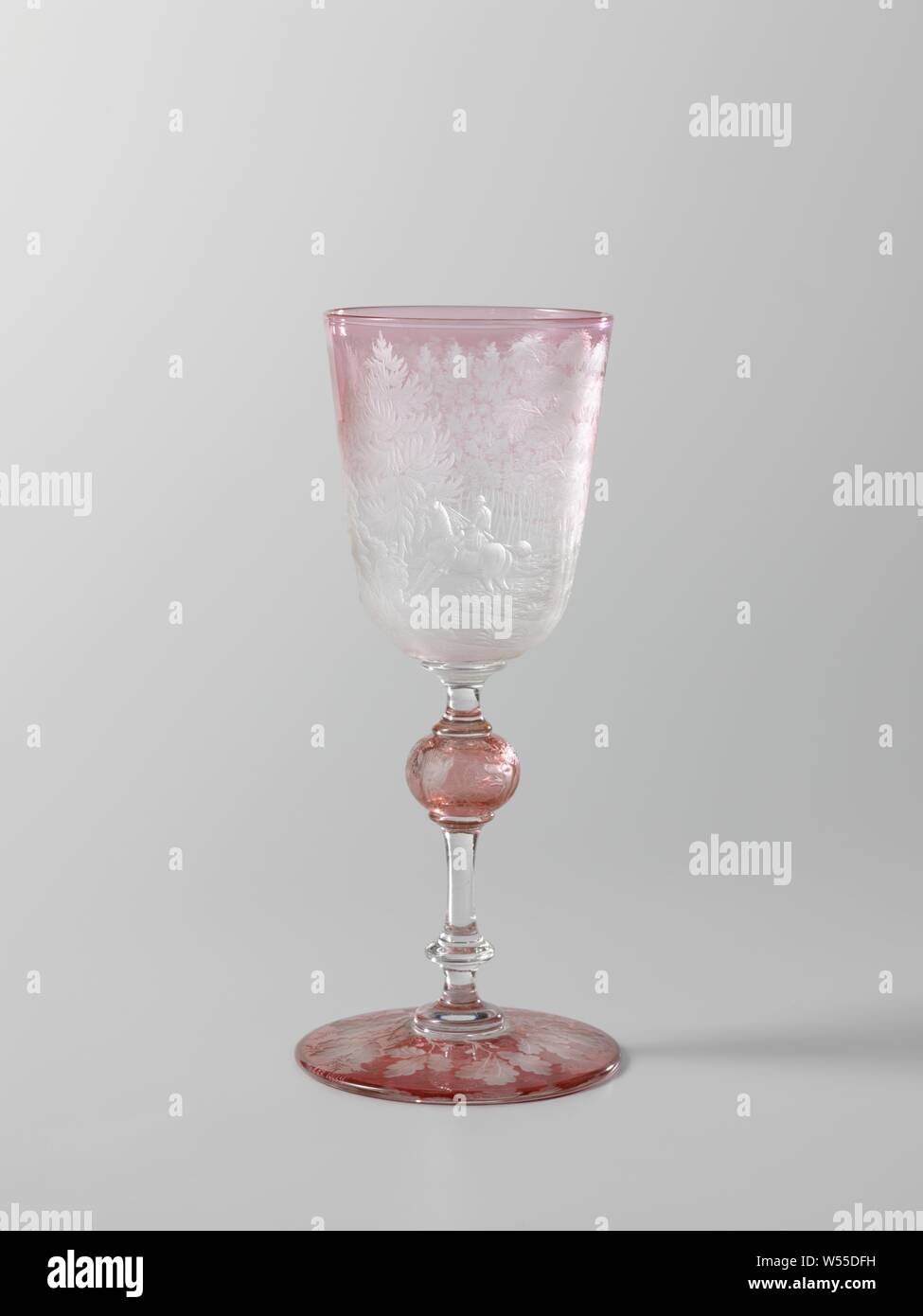 Wine glass, Goblet with hunting scenes, Conic foot. Faceted cut stem with a hollow knot and two discs. Funnel shaped chalice with rounded bottom. Pink-red Überfang. Cut and engraved with oak leaf on the foot, a deer, a hunting dog and a wild boar on the knot and on the calyx a hunting scene with a rider, three hunting dogs and a wild boar, with a castle in the background. Signed at the bottom of the chalice: JB. Simon Gv. 1859 .., hunting, chase, Jean Baptiste Simon, Paris, 1859, glass, grinding, h 21.5 cm × d 9.7 cm d 9.7 cm Stock Photo