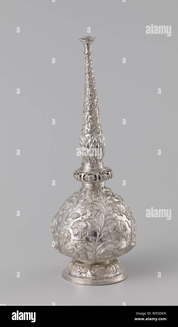 Rose-water bottle of silver driven with flower and leaf vines, Rose-water bottle on profiled foot with pear-shaped body and detachable elongated neck ending in a flower-shaped peak. There are gaps between the stamens of the flowers. The entire bottle is decorated with floral and leaf vines. Above the nodus-shaped broadening on the underside of the neck we see a decoration of pointed, scaly-laid leaves (pineapple?). India or Sri Lanka, 18th century., anonymous, India, c. 1700 - c. 1725, silver (metal), h 30.2 cm × d 11.5 cm d 8.2 cm Stock Photo