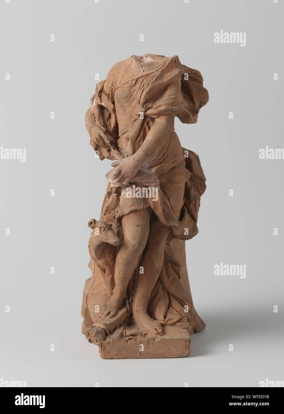 Study of a standing Diana with quiver, torch and greyhound, in front of a garden statue, Study in terracotta, carelessly modeled, of a standing Diana with quiver, on square plinth on the front. Sketch for a garden image. The head is missing and the right hand has been restored. Diana is a counterpart to Apollo. Note: this unsigned Diana is a preliminary study for a garden statue in sandstone, which is located on the country estate ....., Ignatius van Logteren, Amsterdam, c. 1725, terracotta (clay material), h 32.5 cm × w 15 cm × d 18.2 cm Stock Photo