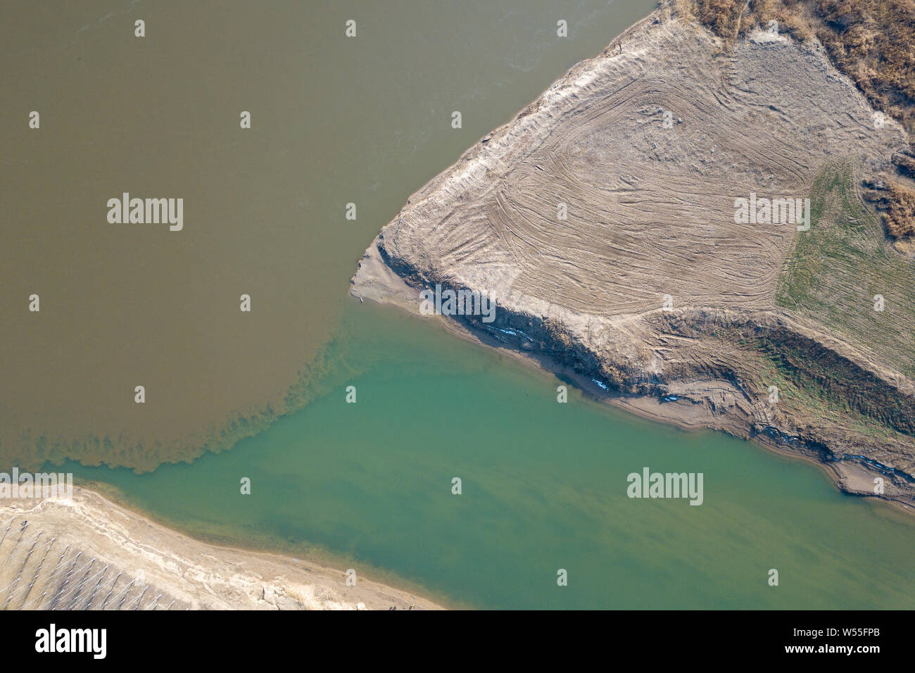 The clean Jing River meets the sandy Wei River in Xi'an city, northwest China's Shaanxi province, 13 January 2019. Stock Photo