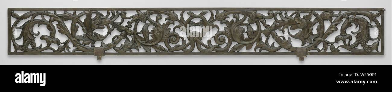 Bailey railing Counter, Bronze counter, elongated, rectangular window, filled with openwork decoration consisting of two snakes interconnected in the middle, on each side leaf vines with bunches of fruit. Two protrusions for a hinge pin on one long side, one ring on both short sides, and different rings on the front and back. From the exchange bank, foliage, tendrils, branches, ornament, ornament derived from animal forms, Exchange bank, City Hall of Amsterdam (1655-1808), Hemony, Amsterdam, 1656 - 1657, brass (alloy), h 28.3 cm × l 224.5 cm × t 3.8 cm d 1.3 cm d 0.5 cm w 70.4 kg Stock Photo