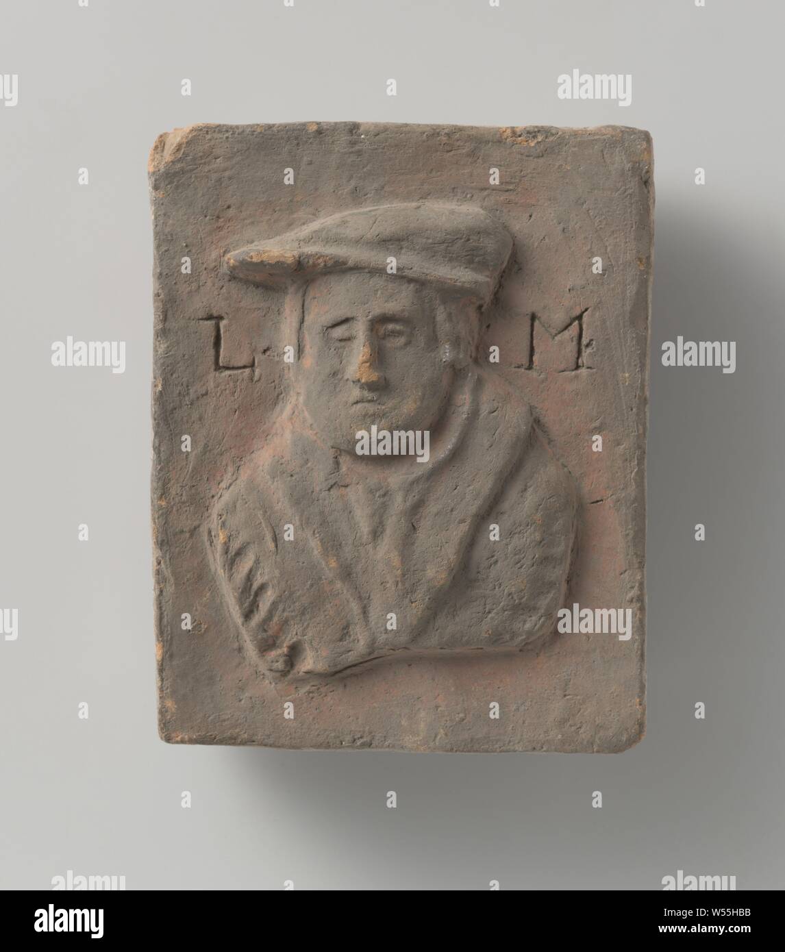 Tile with a representation of Martin Luther Tile with a representation of Martin Luther, Tegel with a representation of Martin Luther and the letters: L.M, Martin Luther, anonymous, Luik, c. 1550 - c. 1650, earthenware, h 13.0 cm × w 10.5 cm × t 4.0 cm Stock Photo