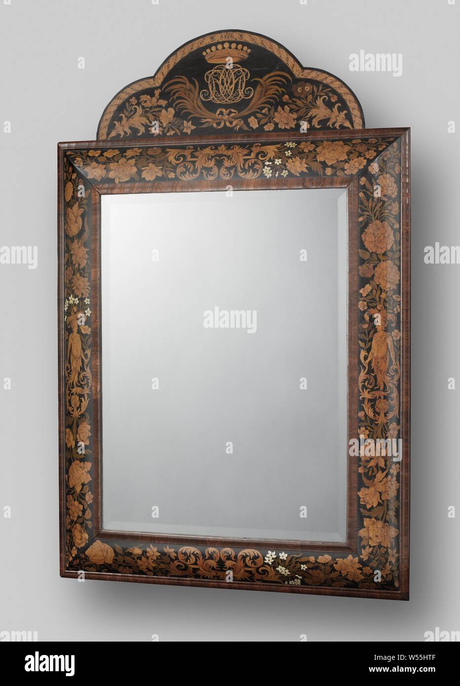 Two mirror frames Mirror frame decorated with marquetry and with a  scalloped attachment with in the middle initials above which a crown and  including crossed palm branches held together by a ribbon
