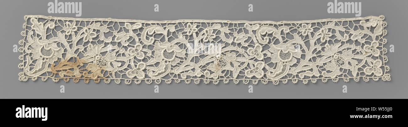 Cuff of needle lace with tongue-in-cheeked flower, Cuff of natural-colored needle lace: Venetian embossed lace. Against an open bar of ground there is a walking pattern of tendrils with pomegranates and a tongue in flower. Along three sides a frame with doubled arches., anonymous, Belgium, c. 1890 - c. 1899, linen (material), Venetian raised work, l 40 cm × w 7 cm Stock Photo