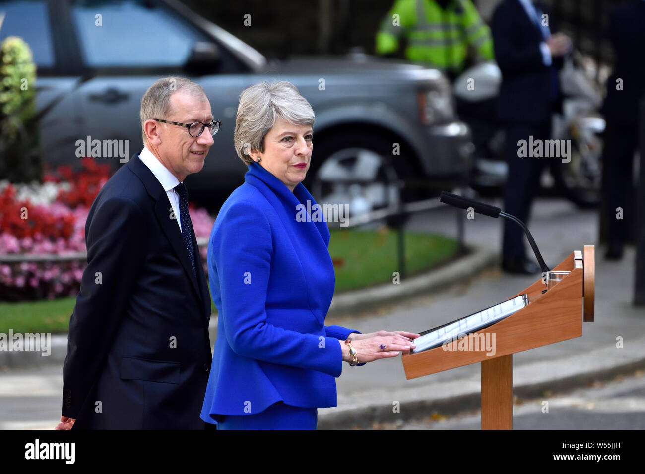 Theresa May with her husband Philip in Downing Street delivering her last speech as Prime Minister before leaving to hand in her resignation to the Qu Stock Photo