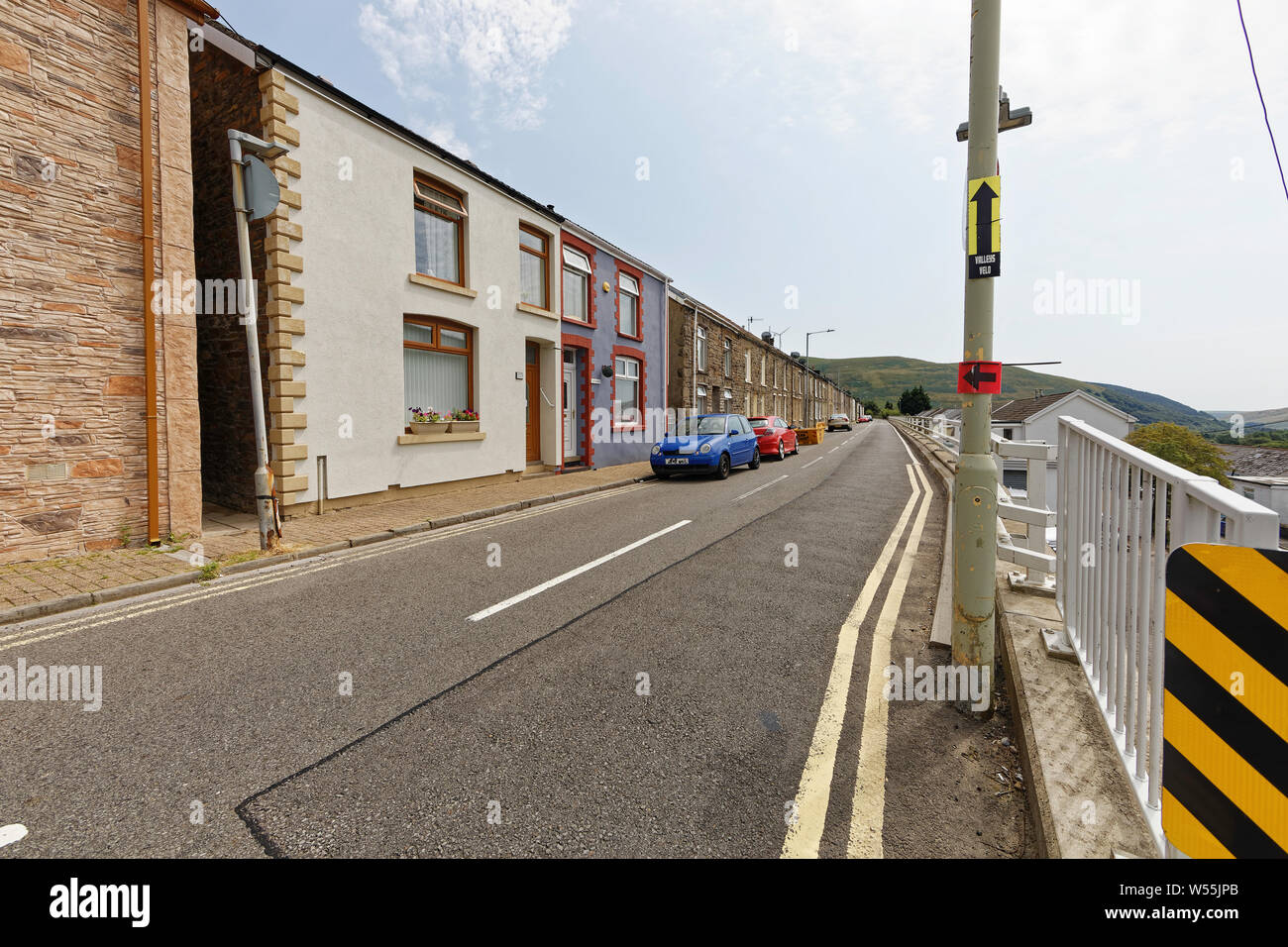 Streets of small former miners cottages in long rows in the valleys of south wales. Many being refurbished after the closing of all collieries. Stock Photo