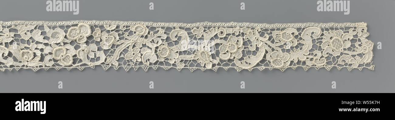 Strip of needle lace with hanging branch, Strip of natural colored needle lace: Venetian embossed lace. There is an interrupted branch with palmetal flowers and volute leaves on an irregular ground. Straight list of dots, in turn large and small., anonymous, Burano, c. 1675 - c. 1690 and/or c. 1875 - c. 1909, linen (material), Venetian raised work, l 75 cm × w 7.5 cm Stock Photo