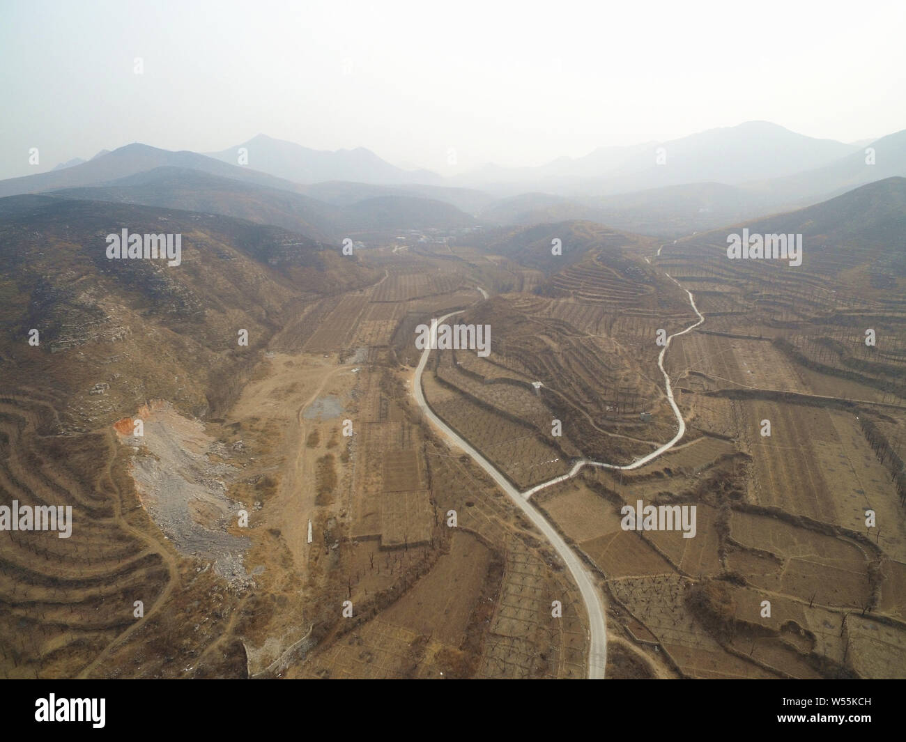 An aerial view of the mountain land and villas under construction in the Xiulan Culture Town Project developed and constructed by Xiulan Group, in Man Stock Photo