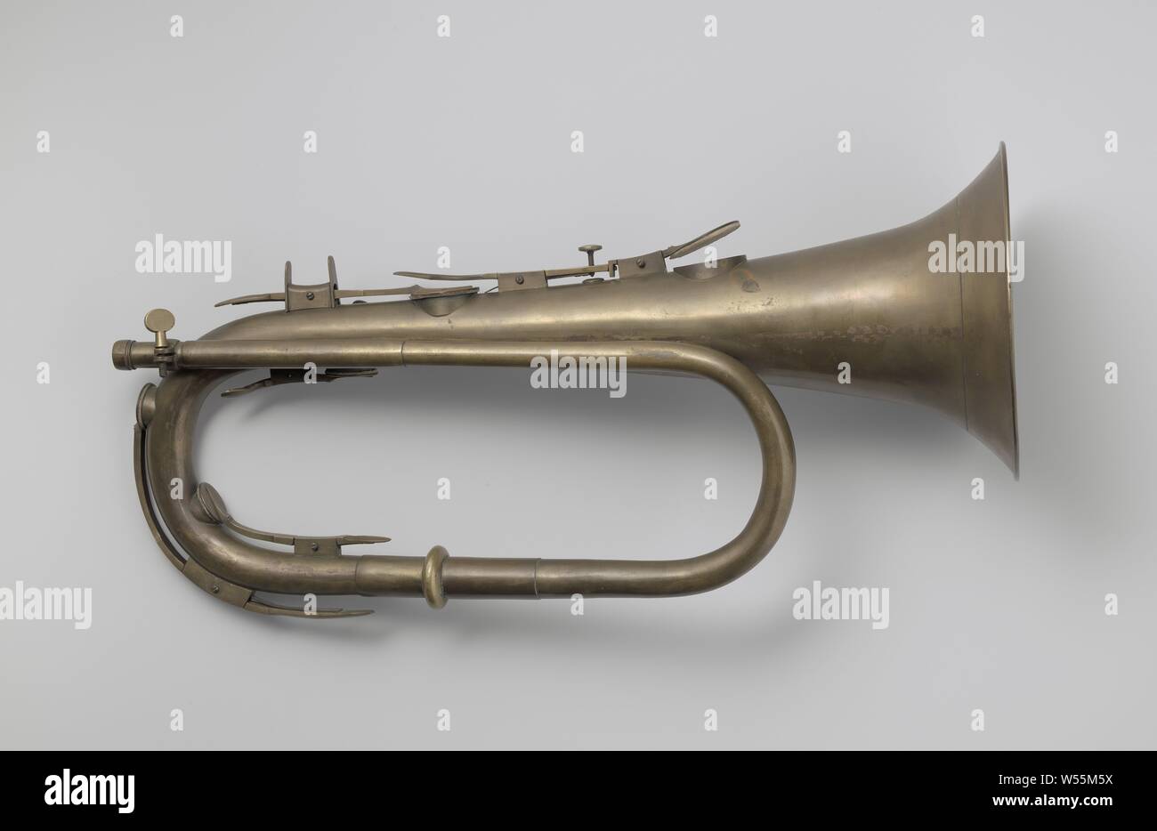 Keyed Bugle, Valve bracket in Bb with six valves, the lower of which is open and equipped with adjusting screw. a support saddle for the middle finger of the right hand. The key of the third valve continues below. Nozzle missing., Lamentation over the dead Christ by his relatives and friends (Christ usually without crown of thorns), Ludwig Embach & Co (mentioned on object), Amsterdam, c. 1830 - c. 1840, brass (alloy), h 44.5 cm × w 21.0 cm d 16.5 cm Stock Photo