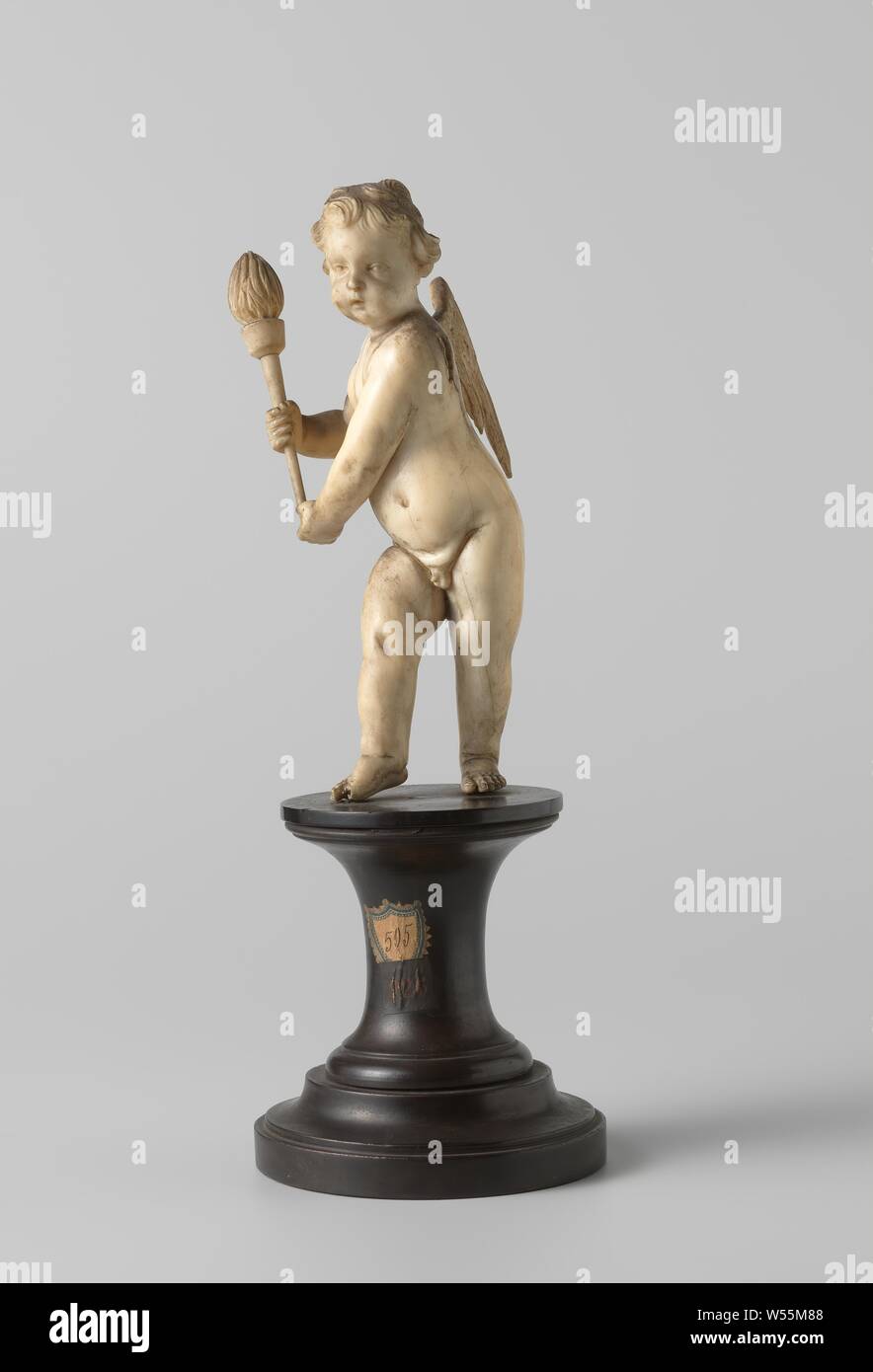 Amor in the form of an angel with torch, Amorphic figure of ivory in the form of an angel with torch., anonymous, 1700 - 1800, ivory, cutting, h 31 cm × h 19.5 cm Stock Photo