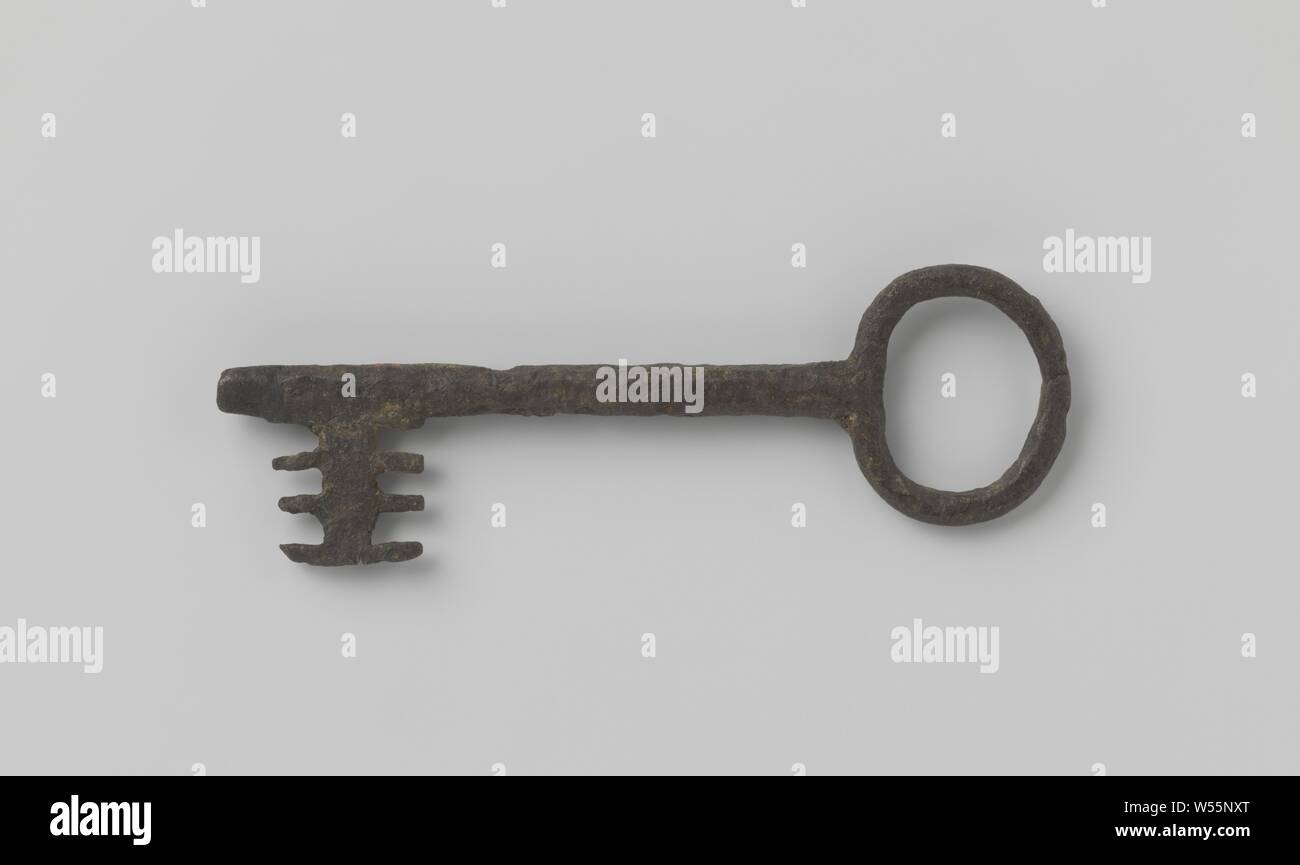 Key with round eye and double row of teeth on the beard. The shaft continues past the beard., 1300 - 1500, iron (metal), l 16.8 cm × w 5.2 cm Stock Photo