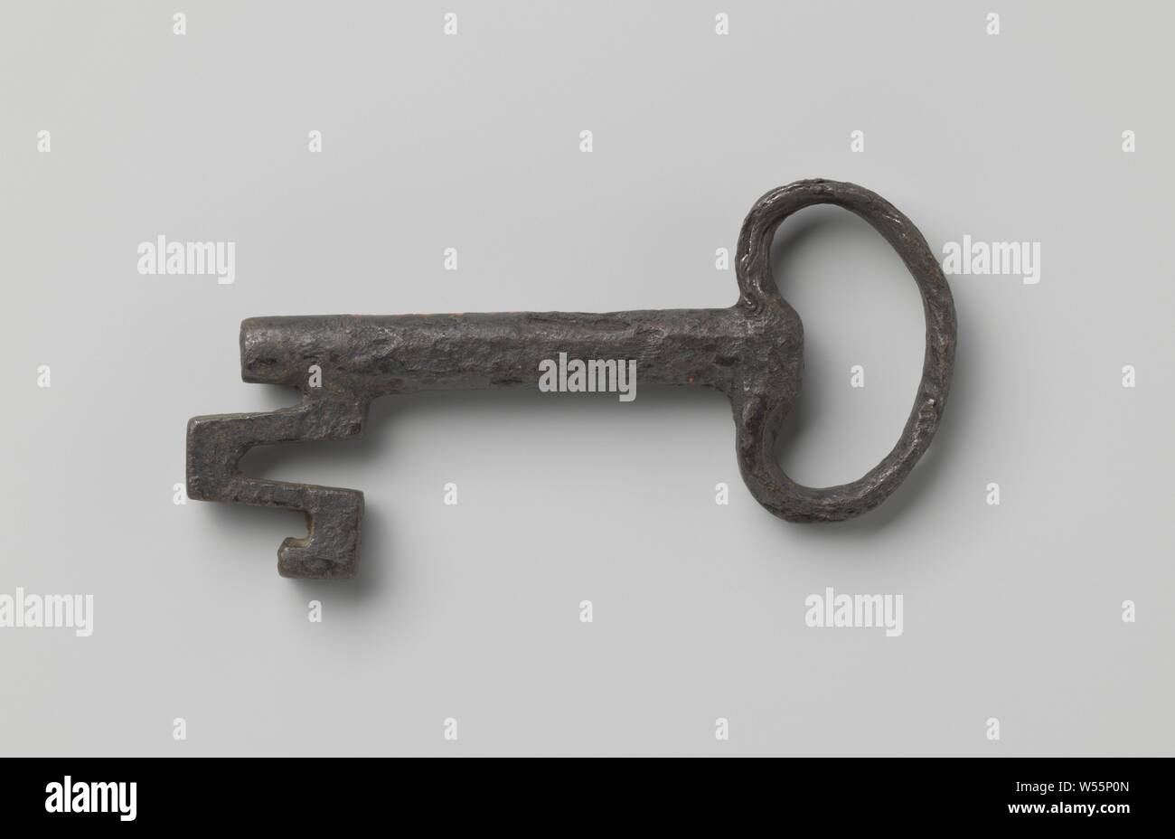 Key with bean-shaped eye. The V-shaped cut beard continues past the shaft., 1500 - 1600, iron (metal), l 8 cm × w 3.5 cm Stock Photo