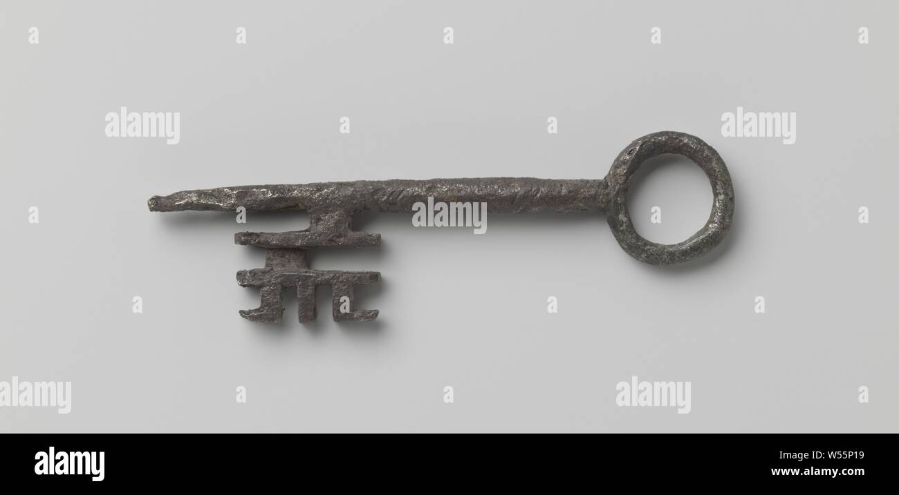 Key with a pointed shaft that runs past the deeply incised beard. Eye annular., c. 1400 - c. 1500, iron (metal), l 12.8 cm × w 3.1 cm Stock Photo