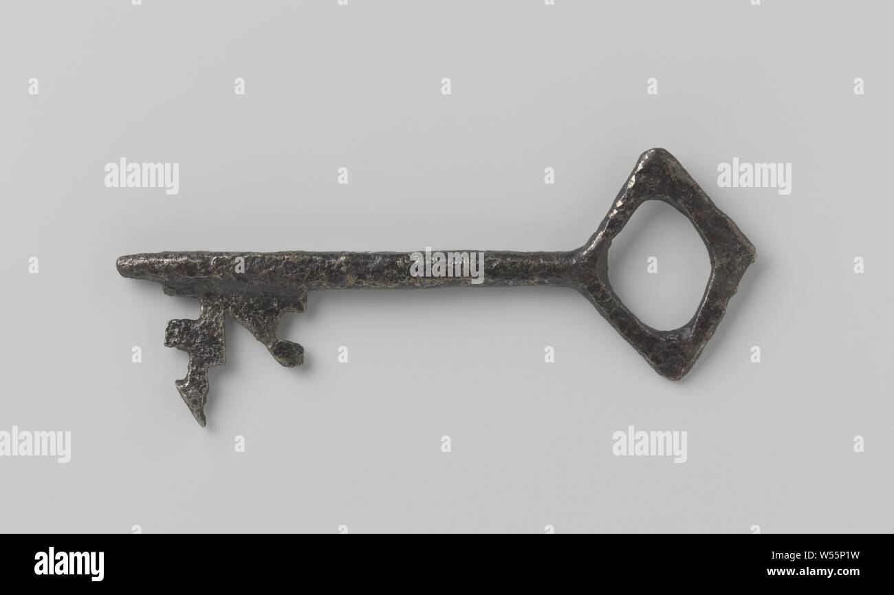 Key with capricious beard, diamond-shaped handle in which an oval eye and a shaft ending in a blunt point and extending past the beard., 1200 - 1400, iron (metal), l 18.3 cm × w 6.7 cm Stock Photo