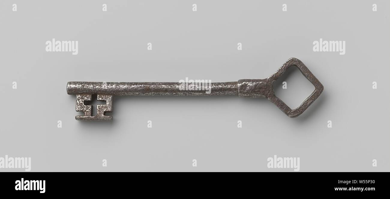 Key with a square eye standing at an angle, which becomes a thickening of the shaft. This runs just past the beard. A cross motif has been carved into the beard., c. 1600 - c. 1699, iron (metal), l 23.5 cm × w 5.3 cm Stock Photo