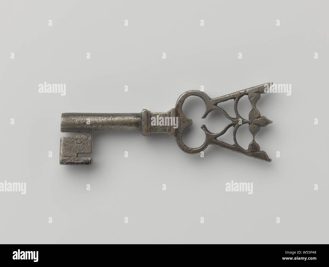Pipe wrench whose handle is clover-leaf shaped and ends in a floral crown. Under the handle is a profiled four-sided capital., France, c. 1400 - c. 1500, iron (metal), l 8.5 cm × w 3.2 cm Stock Photo