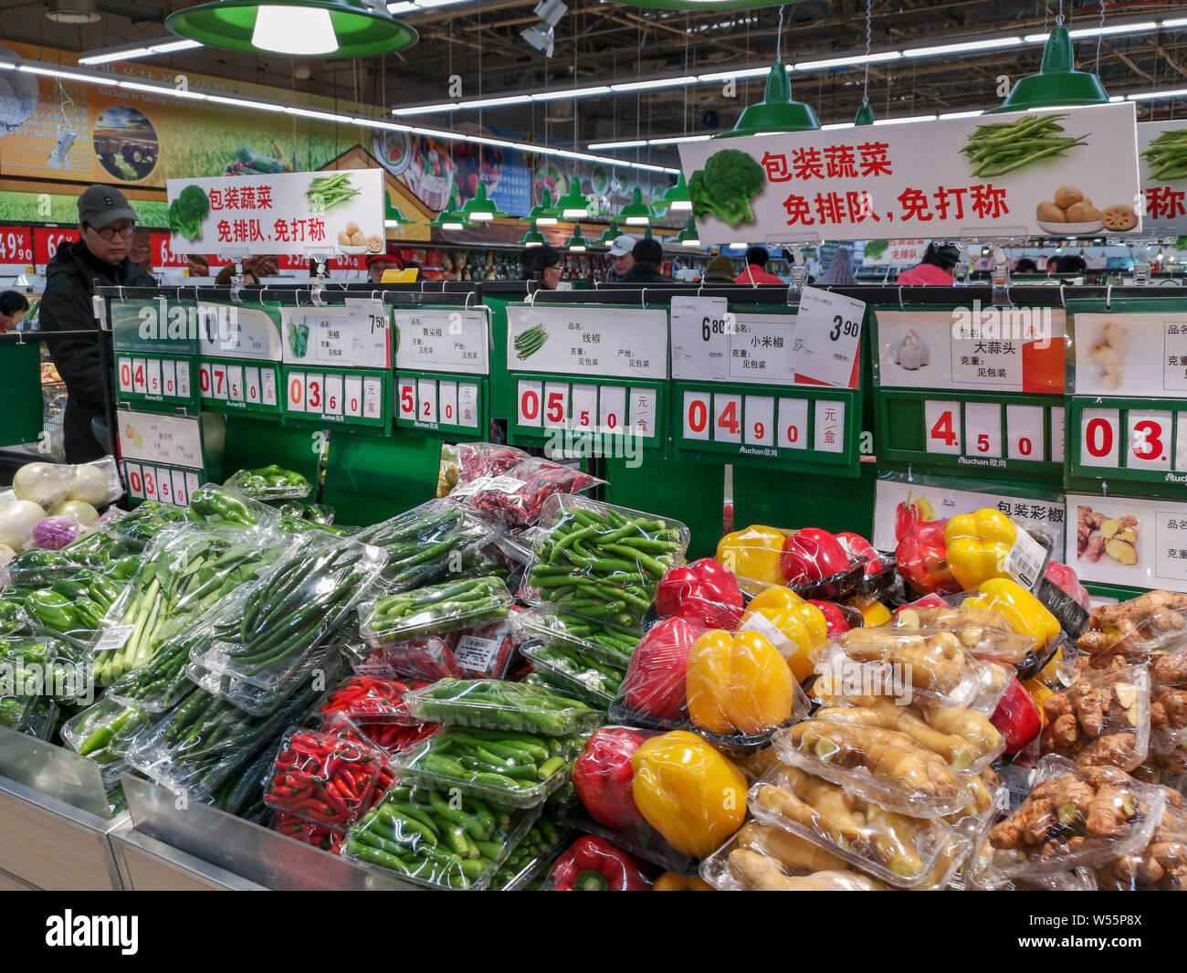 FILECustomers shop for vegetables and fruits at a supermarket in