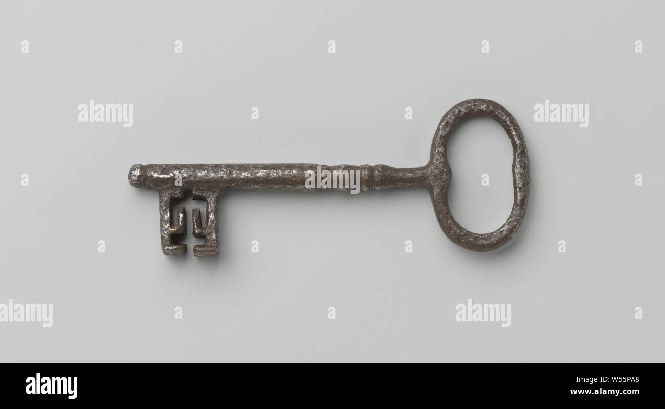 Key with oval eye, simple profiled shaft and double beard. Heavily bitten by a stainless-making agent., c. 1700 - c. 1800, iron (metal), l 13.1 cm × w 5 cm Stock Photo