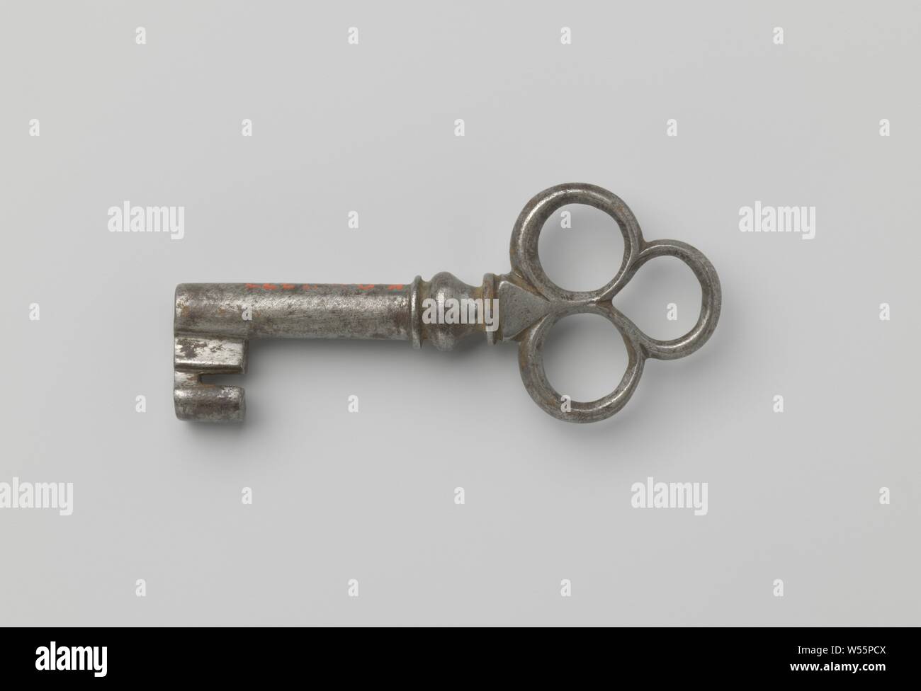 Pipe key with handle composed of three eyes. Capital vaseshaped., c
