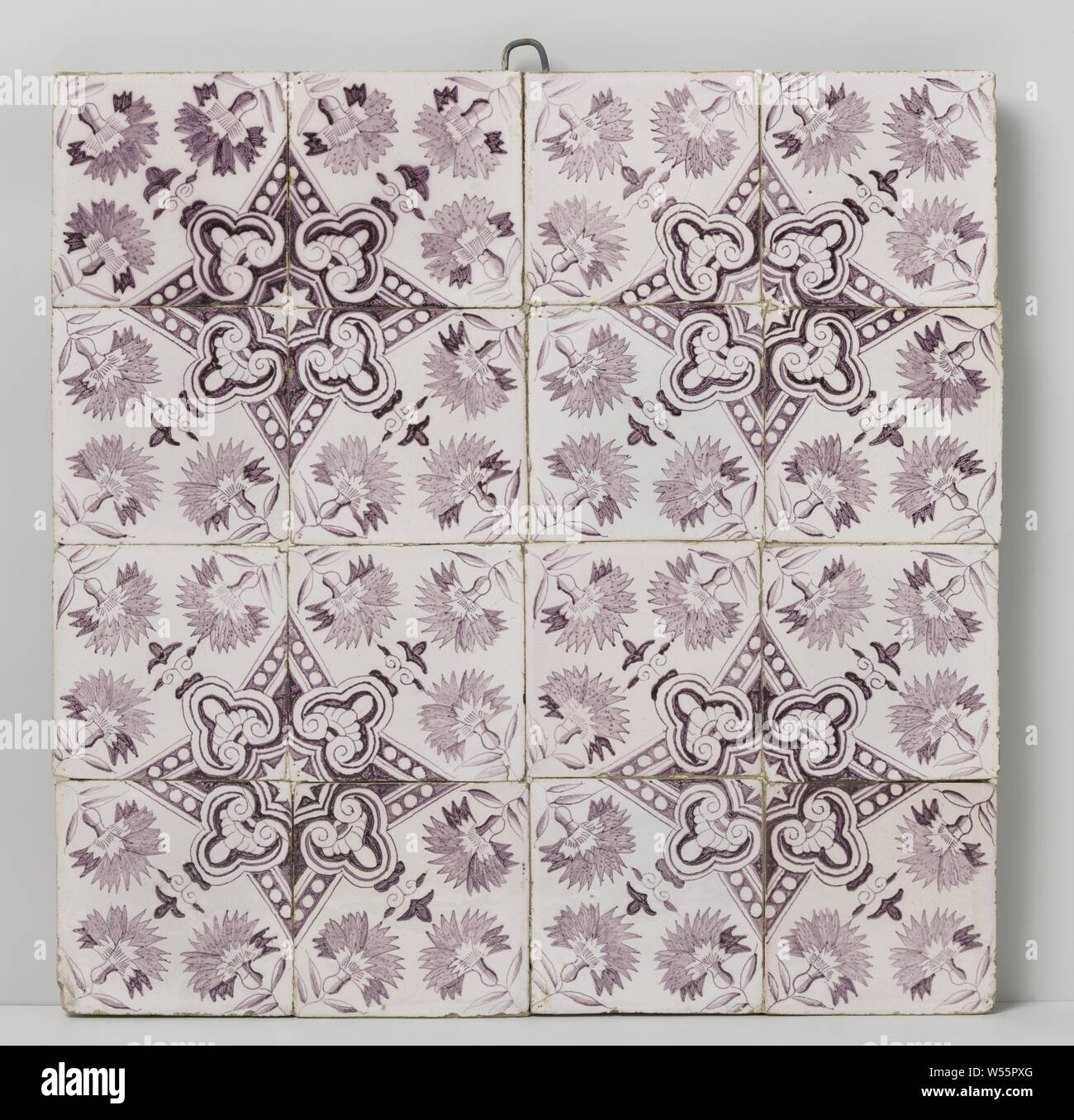 Tile field of sixteen tiles, Tile field of 16 tiles (4 x 4) with purple painted carnations. Four tiles together form a star in the middle., anonymous, 1740 - 1790, earthenware, tin glaze, h 51 cm × w 51 cm × d 2 cm Stock Photo