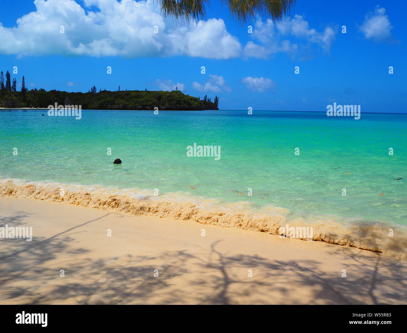 Waves on tropical island beach in the South Seas Stock Photo