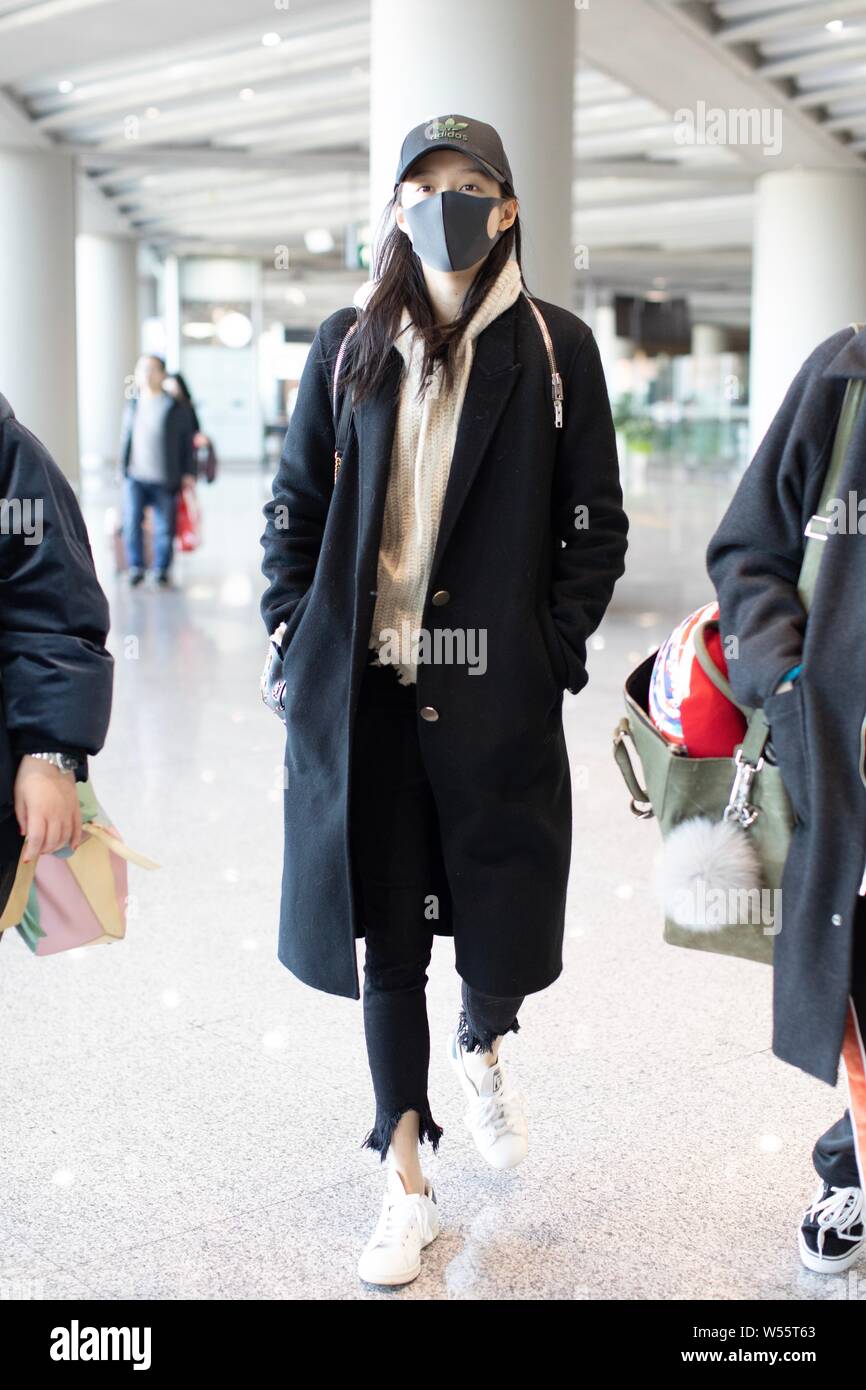 Chinese actress Guan Xiaotong arrives at an airport in Shanghai, China, 20  February 2019. Hat: adidas Handbag: Yves Saint laurent Stock Photo - Alamy