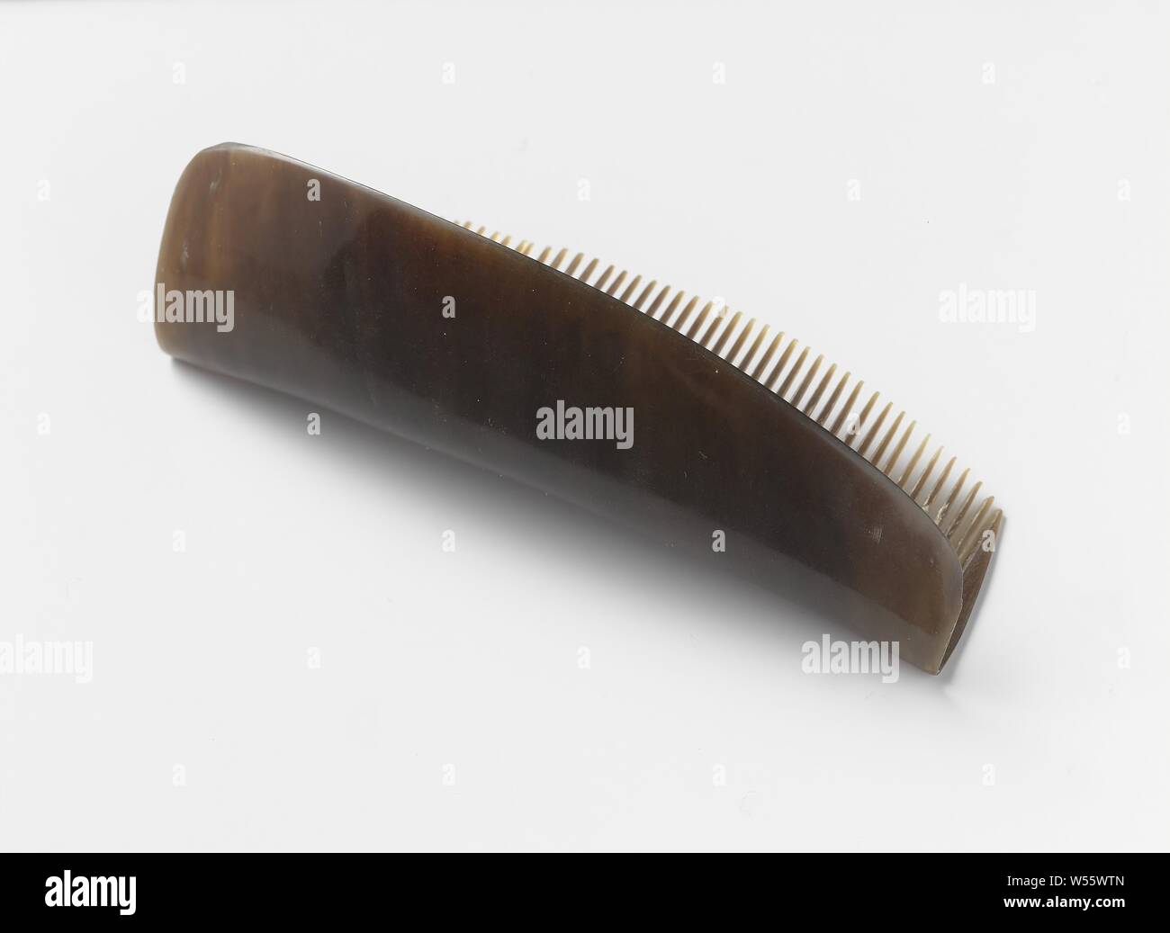 Hair comb of tortoise and horn with an unadorned tapered back that is  perpendicular to the teeth, Hair comb of tortoise and horn with an  undecorated tapered back that is perpendicular to