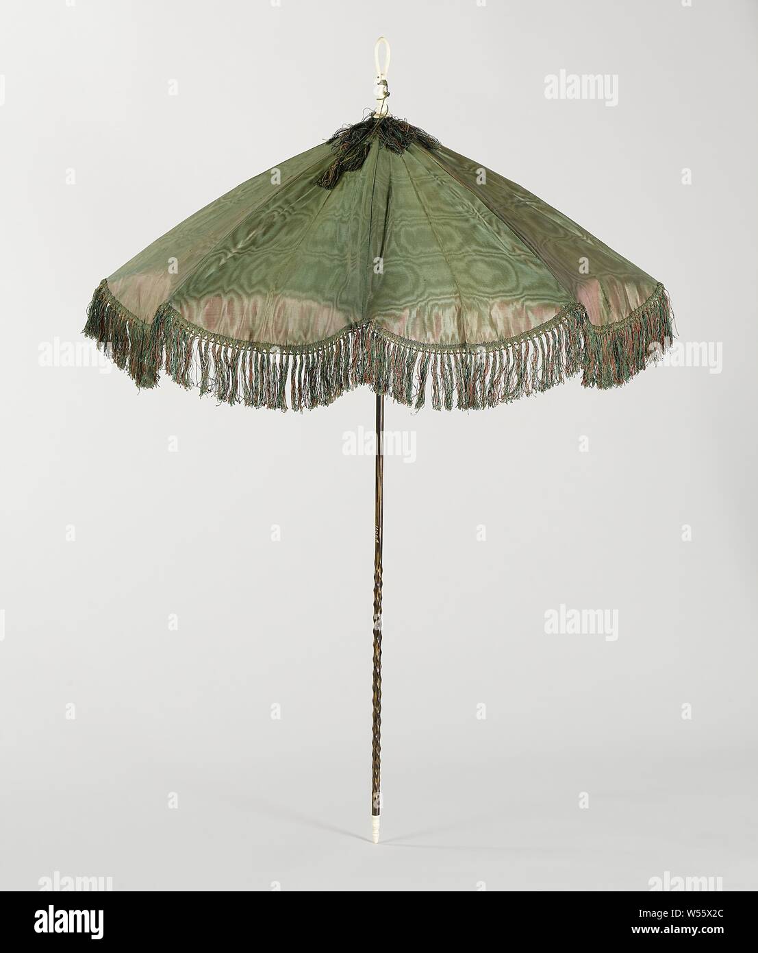 Fringed parasol Parasol with cover of green moiré and changeant side  trimmed with frills, on a long knotty wooden stick with a ring of bone on  top, Parasol with cover of green