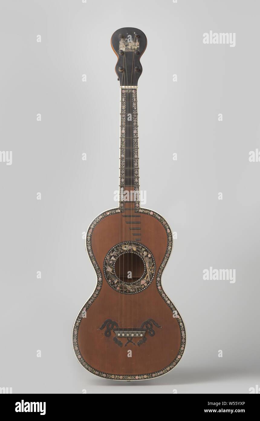 Guitar, Six-string guitar. Rich with perle d'amour black and ivory inlaid. The edge of the rosette is inlaid with figures representing all kinds of musical instruments., M.C. Mousset, Paris, c. 1840, softwood, maple (wood), ebony (wood), metal, mother of pearl, ivory, h 96 cm × w 26.5 cm × d 9 cm Stock Photo