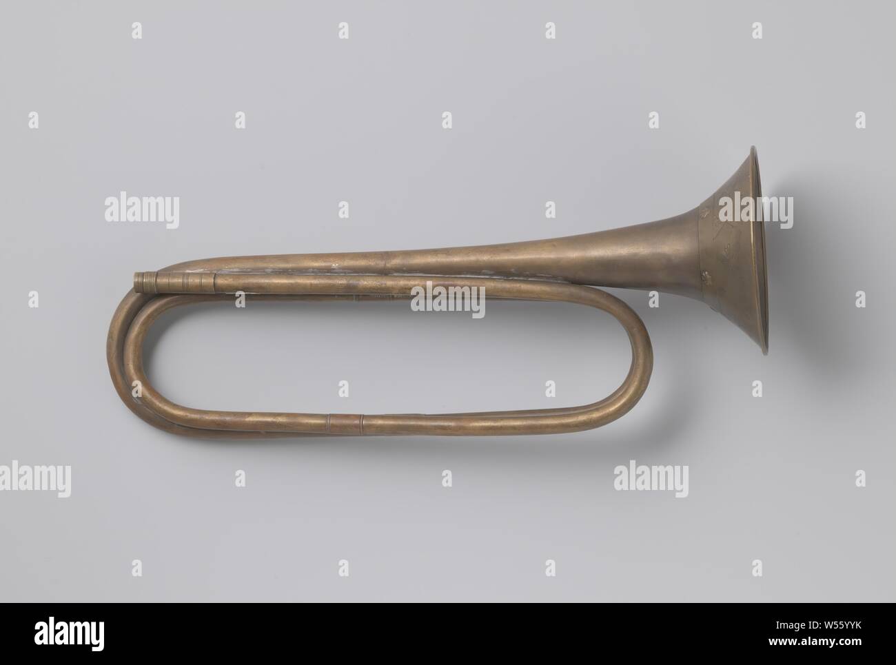 Trumpet, Trumpet in As. Around the cup is a wreath, decorated with leaf ornaments and garland and three crosses. The top edge is decorated with two grooves and a border of shell motifs and relief. Nozzle missing., anonymous, c. 1800, brass (alloy), h 40.0 cm × w 17.5 cm d 12.0 cm Stock Photo