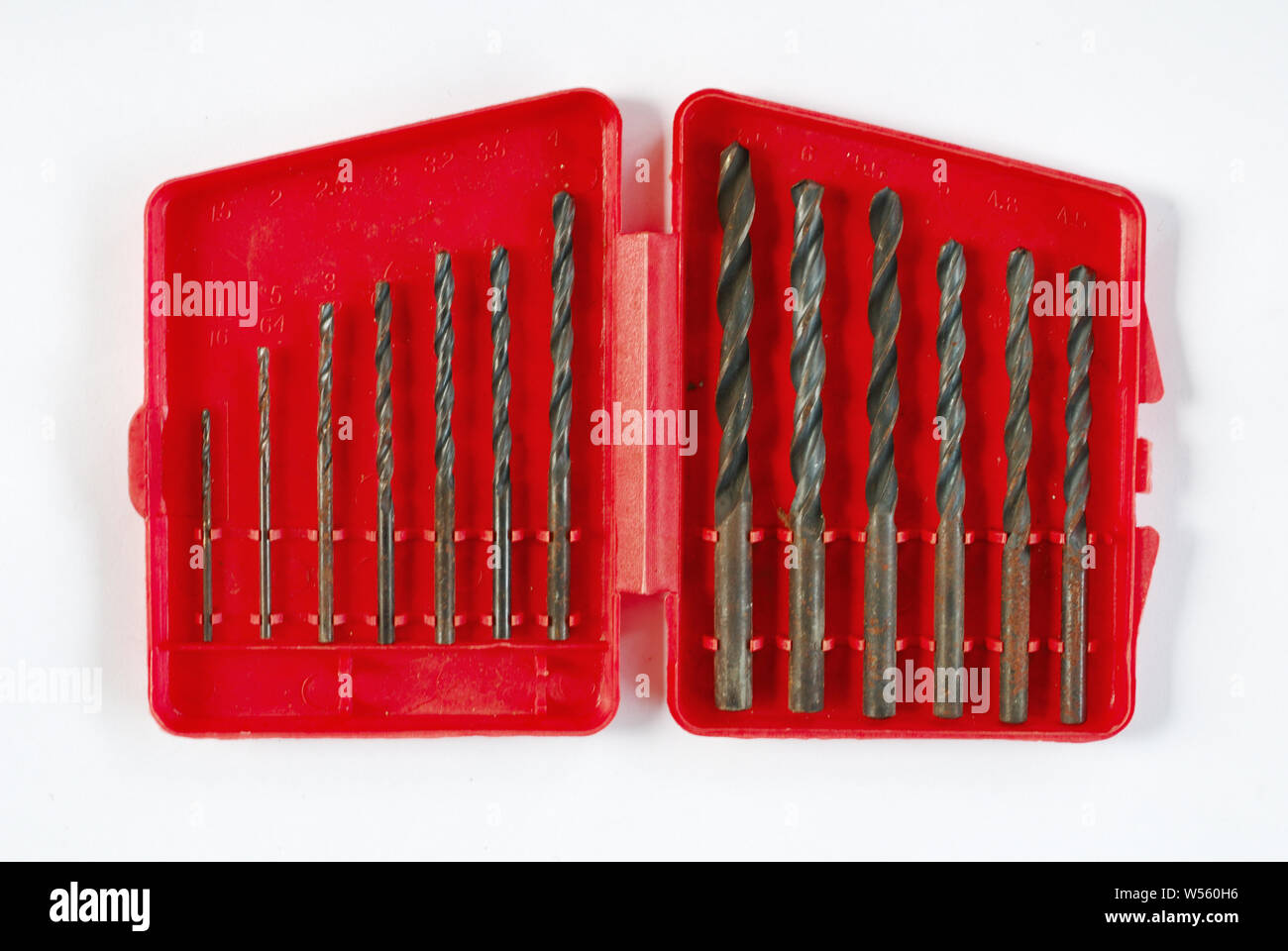 Drill bits of various sizes isolate on white background Stock Photo
