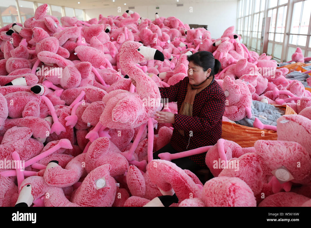 Chinese workers make stuffed toys at a toy factory in Lianyungang city,  east China's Jiangsu province, 21 February 2019. China has posted a  surprise Stock Photo - Alamy