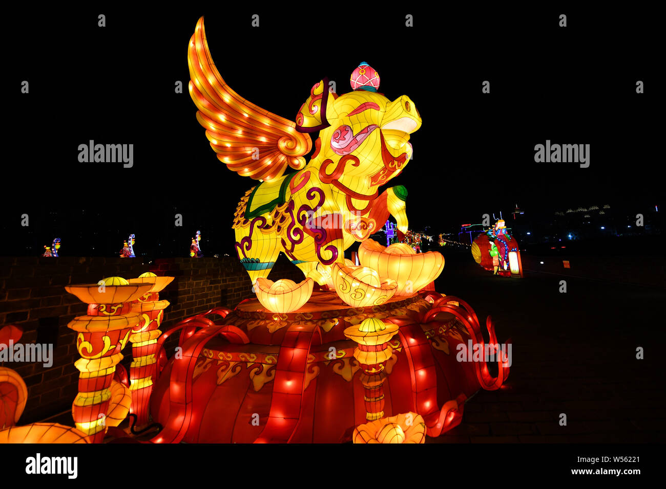 Tourists visit a lantern festival to greet the upcoming Chinese Lunar ...