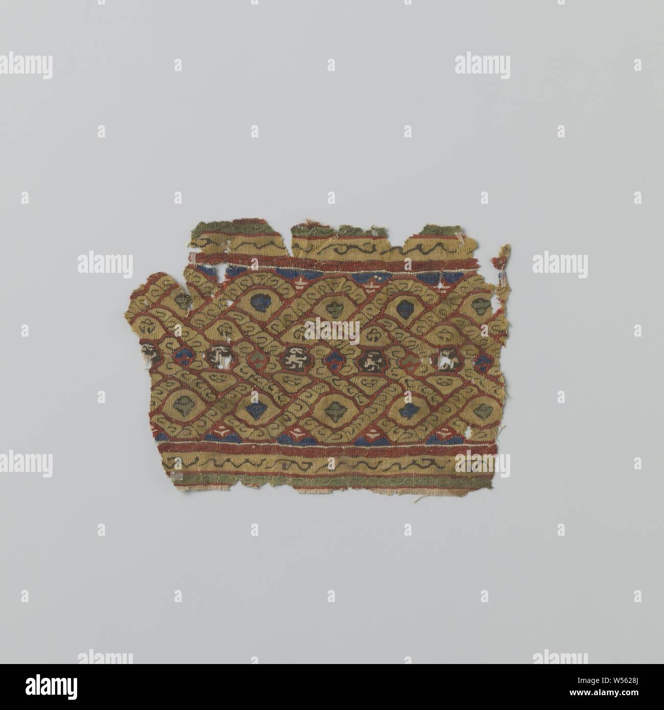 Fabric fragment with decorative band, Natural-colored linen fabric fragment with decorative band with braided band motifs and hares in tapestries., anonymous, Germany (possibly), 1100 - 1199, ketting en inslag, inslag, tapestry, h 10.7 cm × w 15.4 cm Stock Photo