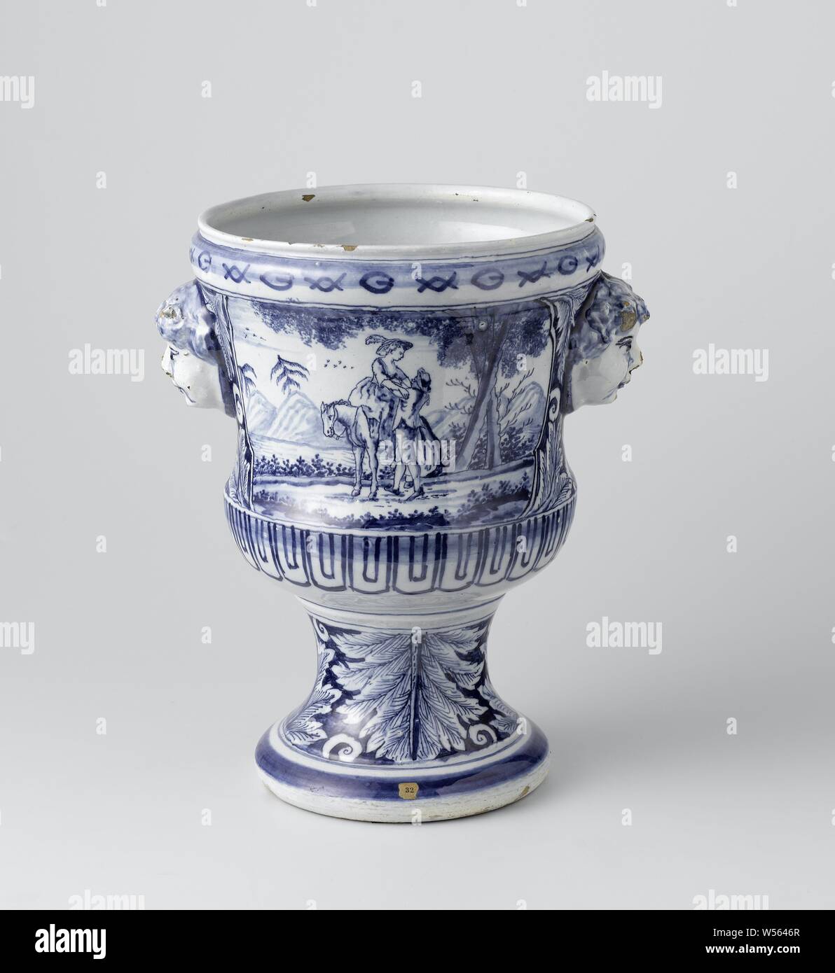 Two flower pot holders (cache pots), Flower pot holder (cachepot), Flower pot holder of faience. With ears in the shape of cobblestones. Painted blue with landscapes, being carried - AA - female human figure, horse, anonymous, Delft, c. 1730 - c. 1770, h 27 cm × d 23 cm Stock Photo
