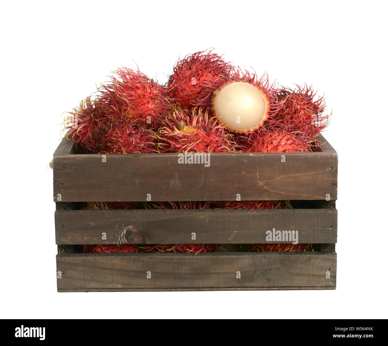 Rambutan in wooden bucket isolated on white Stock Photo - Alamy