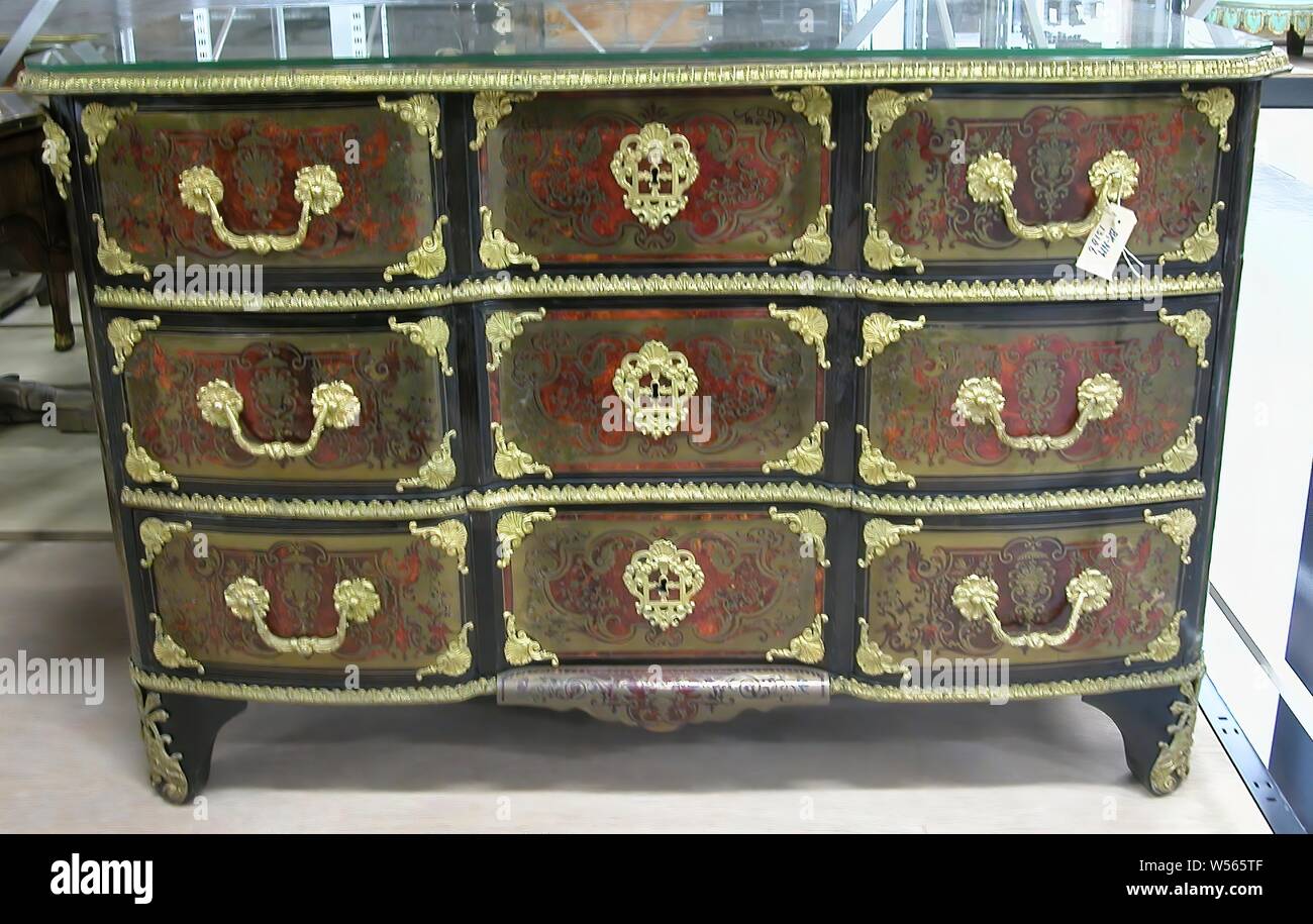 Furniture, Dresser decorated with marquetry of turtle and brass on pine and  oak core. The front plate is bent inwards and has three drawers, which,  like the top, are trimmed with gilt