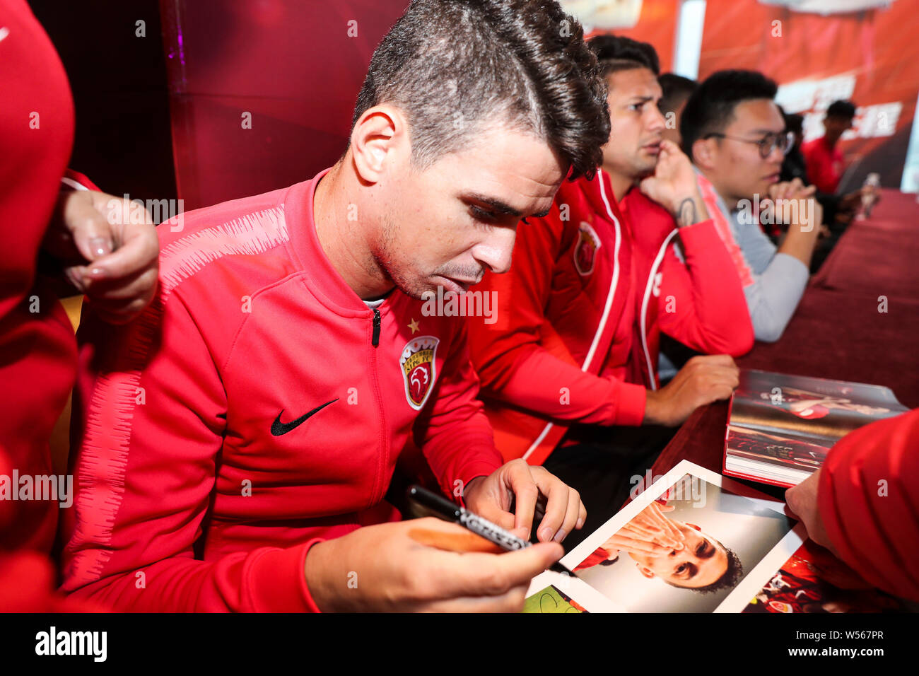 Brazilian football player Oscar of Shanghai SIPG attends a press
