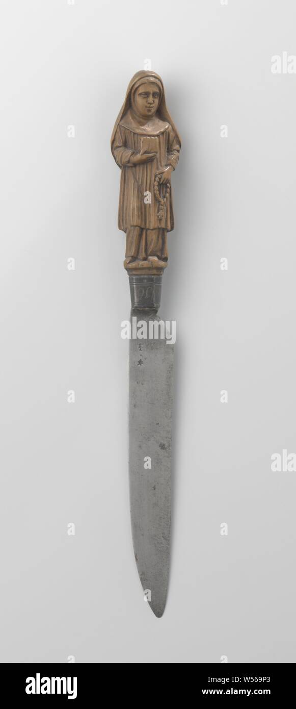 Knife with a handle in the shape of a nun, The nun holds a book in her right hand., anonymous, Netherlands, c. 1600 - c. 1699, boxwood, l 8.5 cm l 23 cm Stock Photo