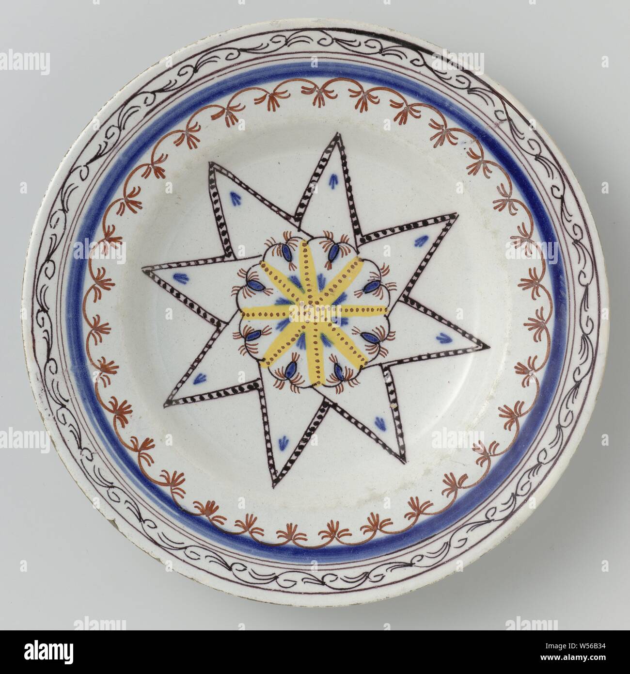 Plate of faience, Plate of faience. Multicolored painted with a star and decorated edges., anonymous, Delft, 1770 - 1800, d 23.3 cm × h 3.4 cm Stock Photo