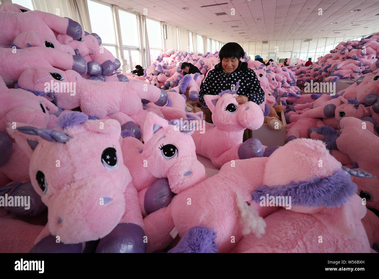 Workers toys factory china hires stock photography and images Alamy