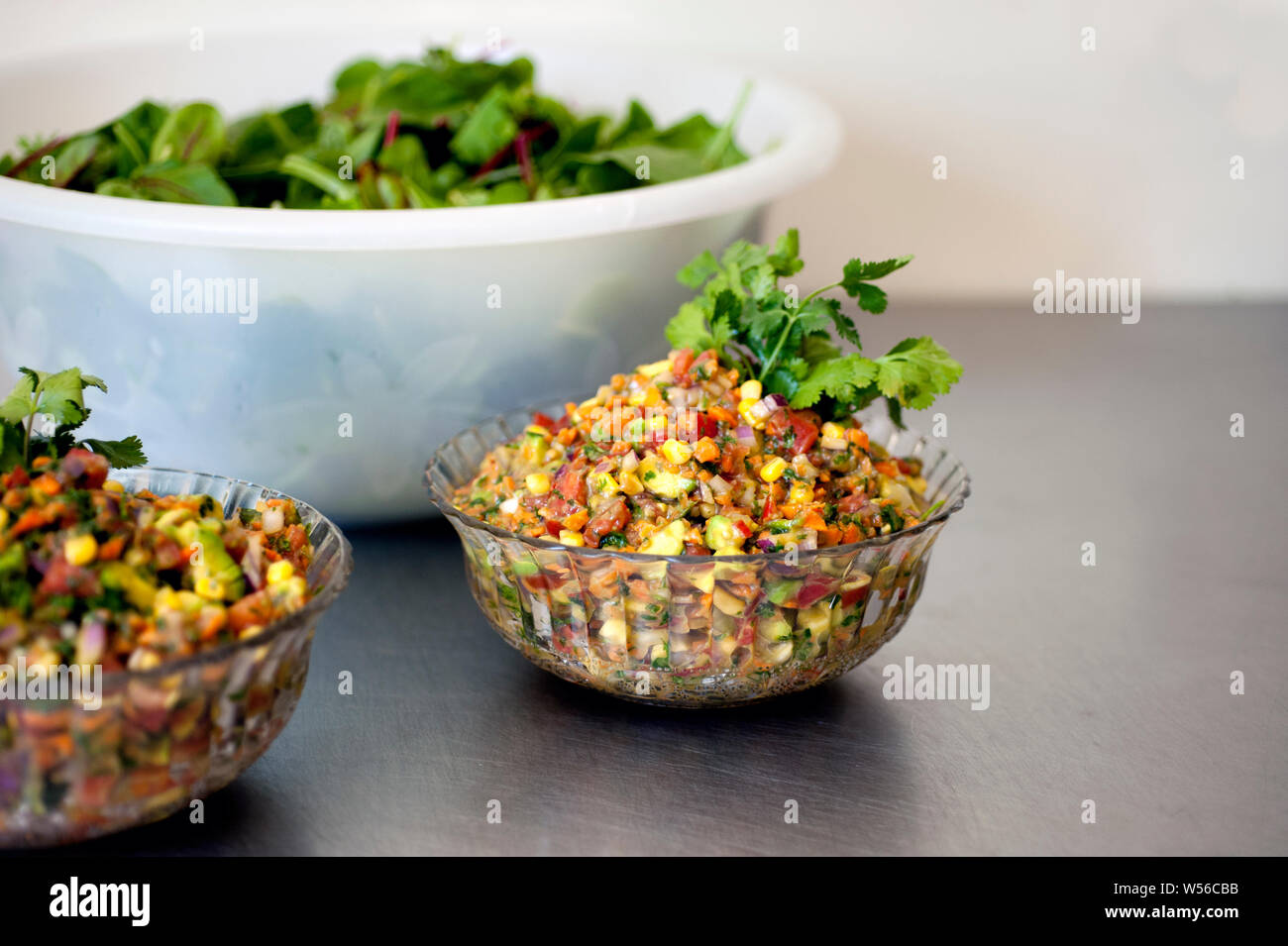 Raw vegan food diet. Corn Salsa. Stock Photo