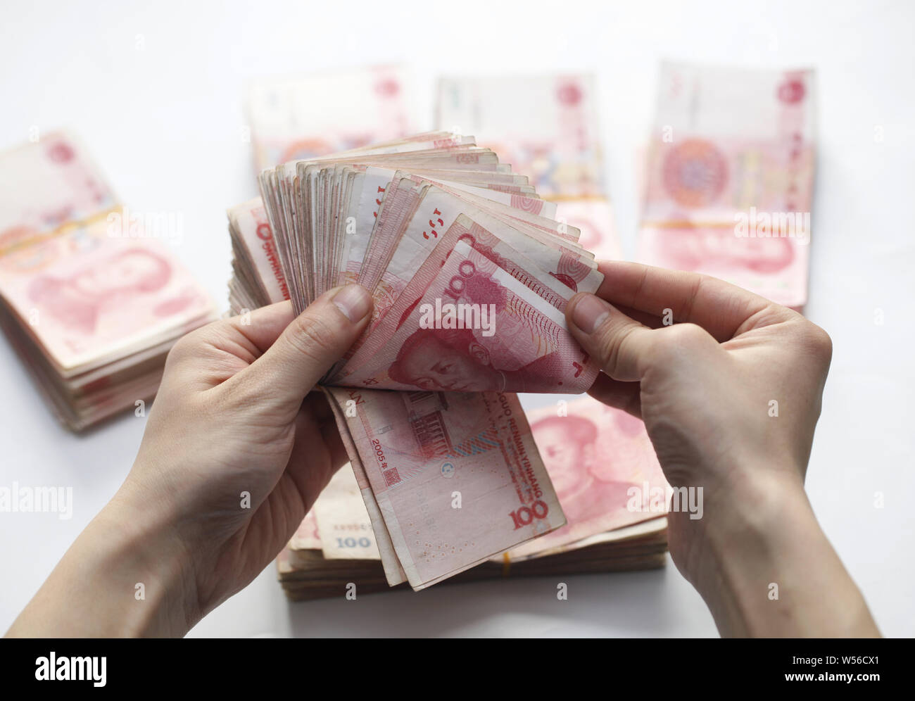 Counting Rmb --FILE--A Chinese clerk counts RMB (renminbi) yuan notes in Anyang city ...