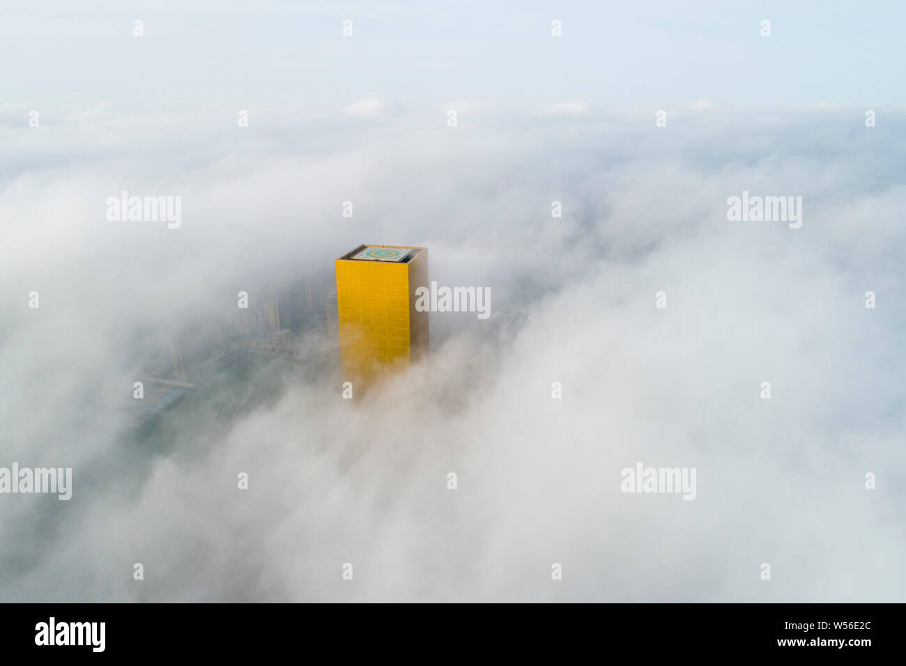 An aerial view of the Howard Johnson Zhongyang Plaza Nantong shrouded ...