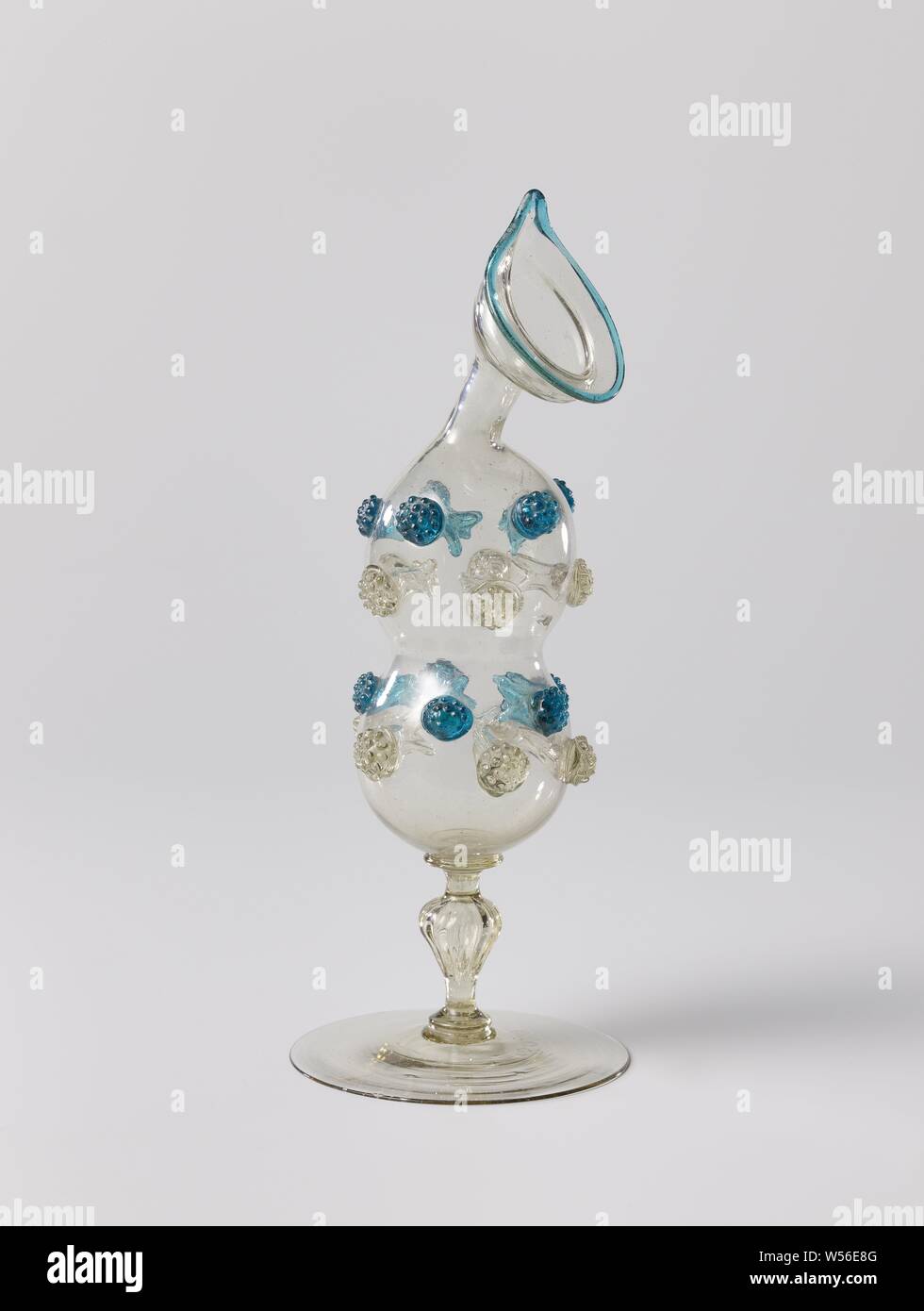 Vial with blackberry buds, Flat base. Baluster-shaped ribbed trunk. The body  is constricted in the middle and has rows of colorless and blue root-shaped  ornaments blown inwards, which are covered on the