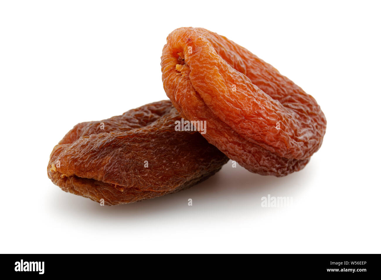 Organic dried apricots isolated on white background Stock Photo - Alamy