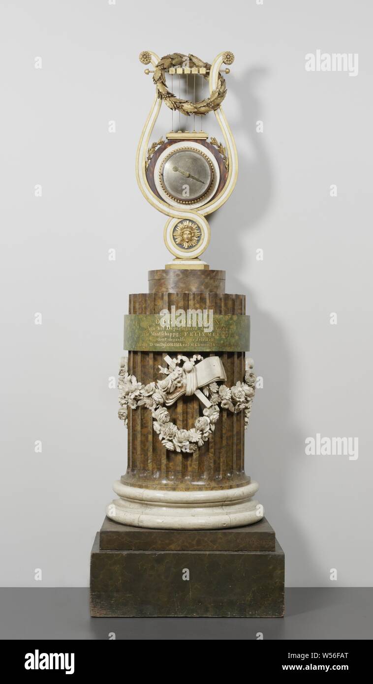Metronome Metronome Metronome, Metronome in the form of a winch on a fluted sawed-through column as a pedestal. the timepiece and percussion is placed in the winch, which is surrounded by a laurel wreath. The column is decorated with a floral wreath. On the plinth, on which the winch stands, staves are placed. On the shaft of the column the following inscription: PRESERVED AT THE DEPARTMENT OF THE MUSIC IN THE FELIX MERITIS SOCIETY BY MEMBERS. A. BUIJN, D. VAN DIJL, C.G.N. HILKER, I.M KLEMAN, J. KUYPER, G.J. PALTHE. On the plinth the name of the maker: C. Welmeer. In garland around the fluted Stock Photo