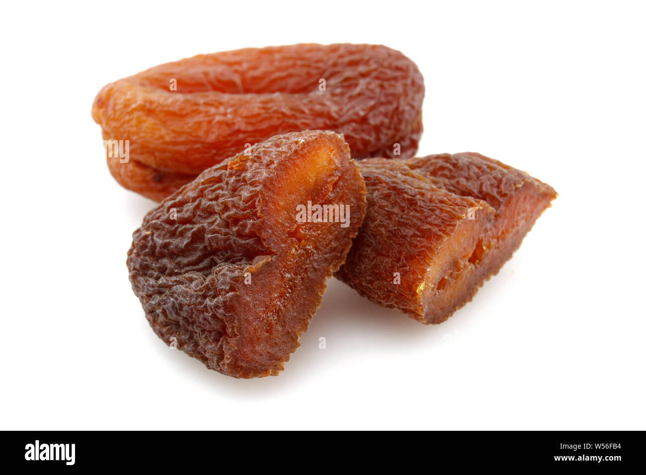 Organic dried apricots isolated on white background Stock Photo - Alamy