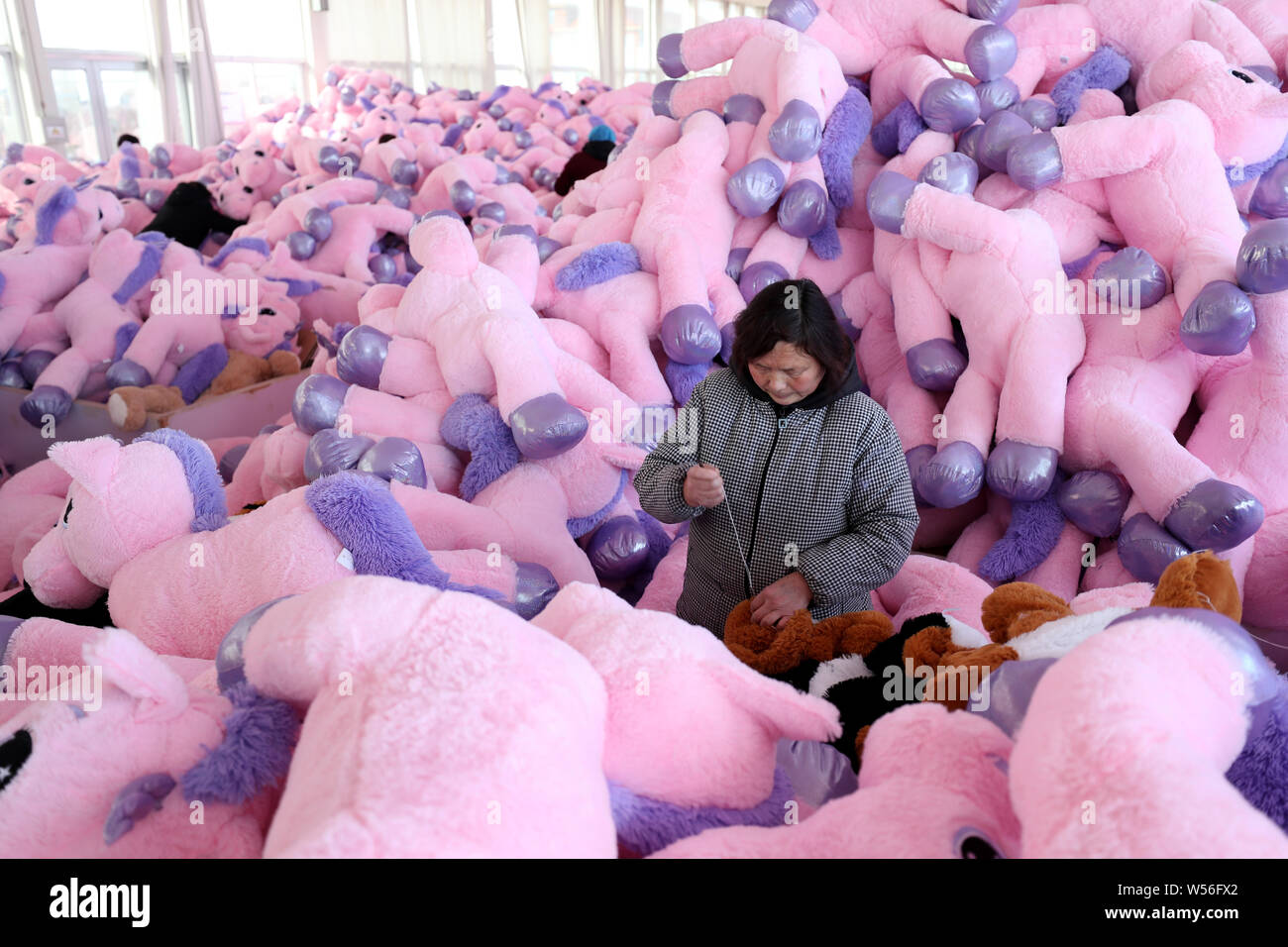 Workers toys factory china hires stock photography and images Alamy